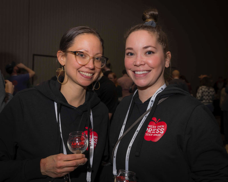 Storie and Ashley from Press Then Press enjoying cider at CiderCon after being named the PNW Cider Retailer of the Year. Photo courtesy of Brandon Buza.