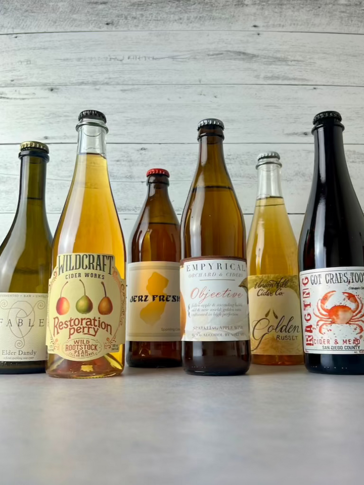 Six bottles of 500 mL ciders, including: Fable Farms, Wildcraft Ciderworks, Durham Cider, Empyrical Cider, Union Hill Cider, and Raging Cider & Mead