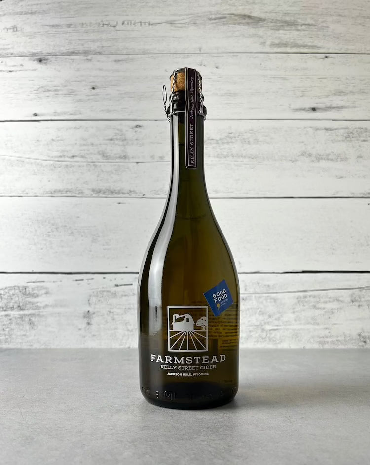 500 mL bottle of Farmstead Kelly Street Cider with blue Good Food Award sticker