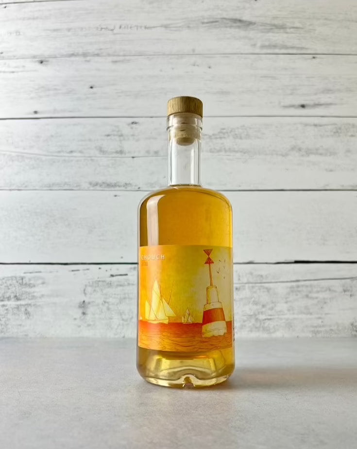 clear bottle of Ferme de Port Coustic - Chouch - aperitif cider with honey