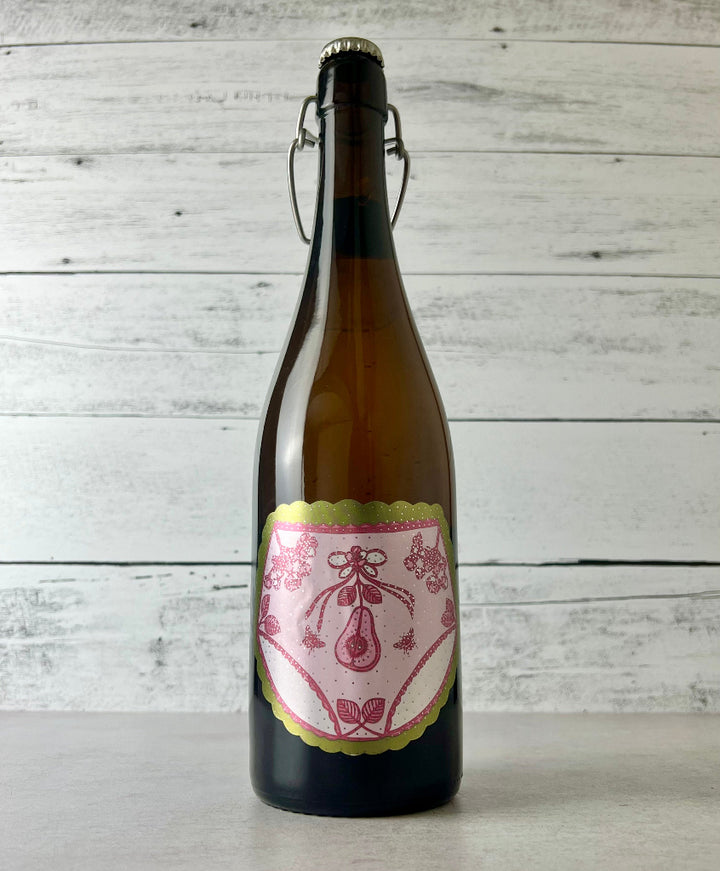 750 mL bottle of Art + Science Cider Lacey's Under Pear Perry with pink pear art label 