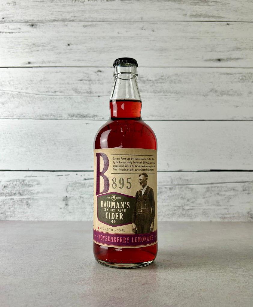 Photo of a 500 mL bottle of Bauman's Century Farm Cider Boysenberry Lemonade cider