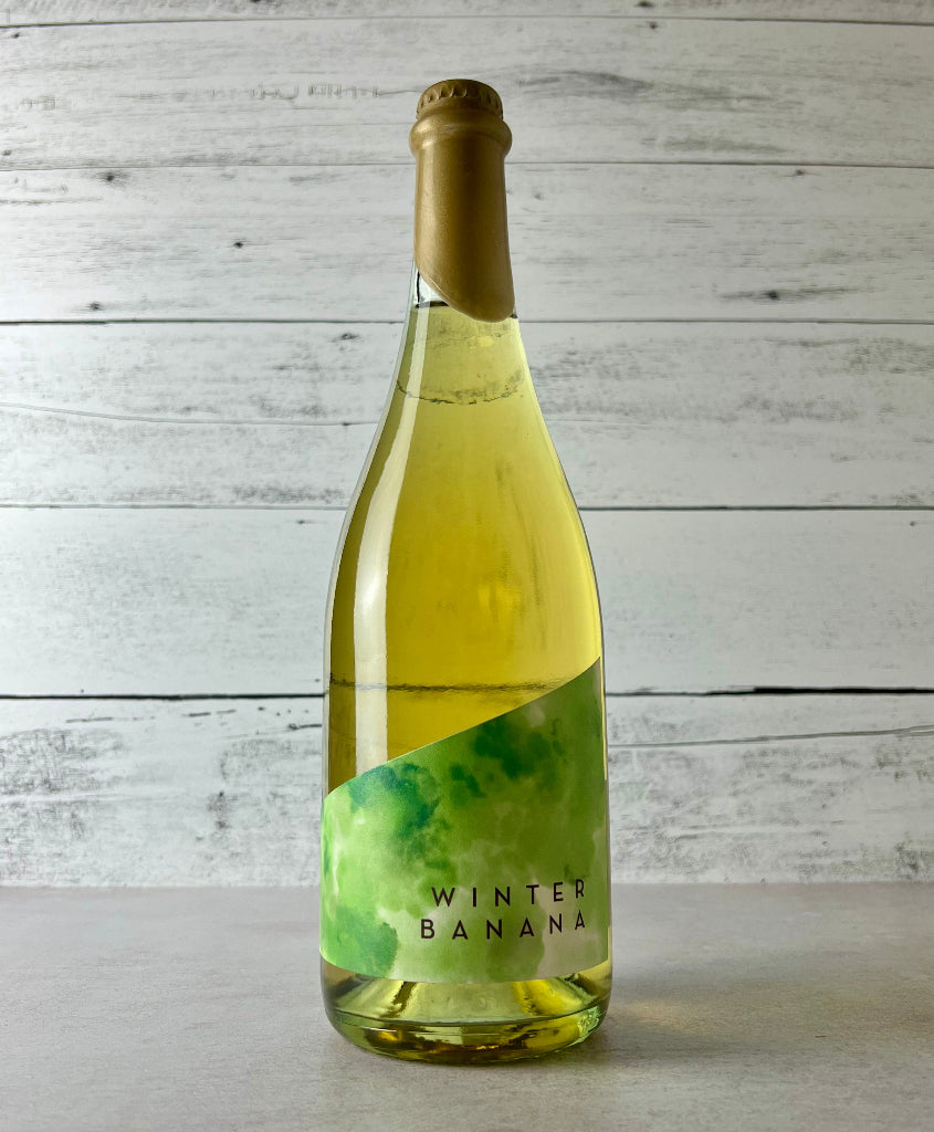 Photo of a 750 mL bottle of Seattle Cider Winter Banana cider