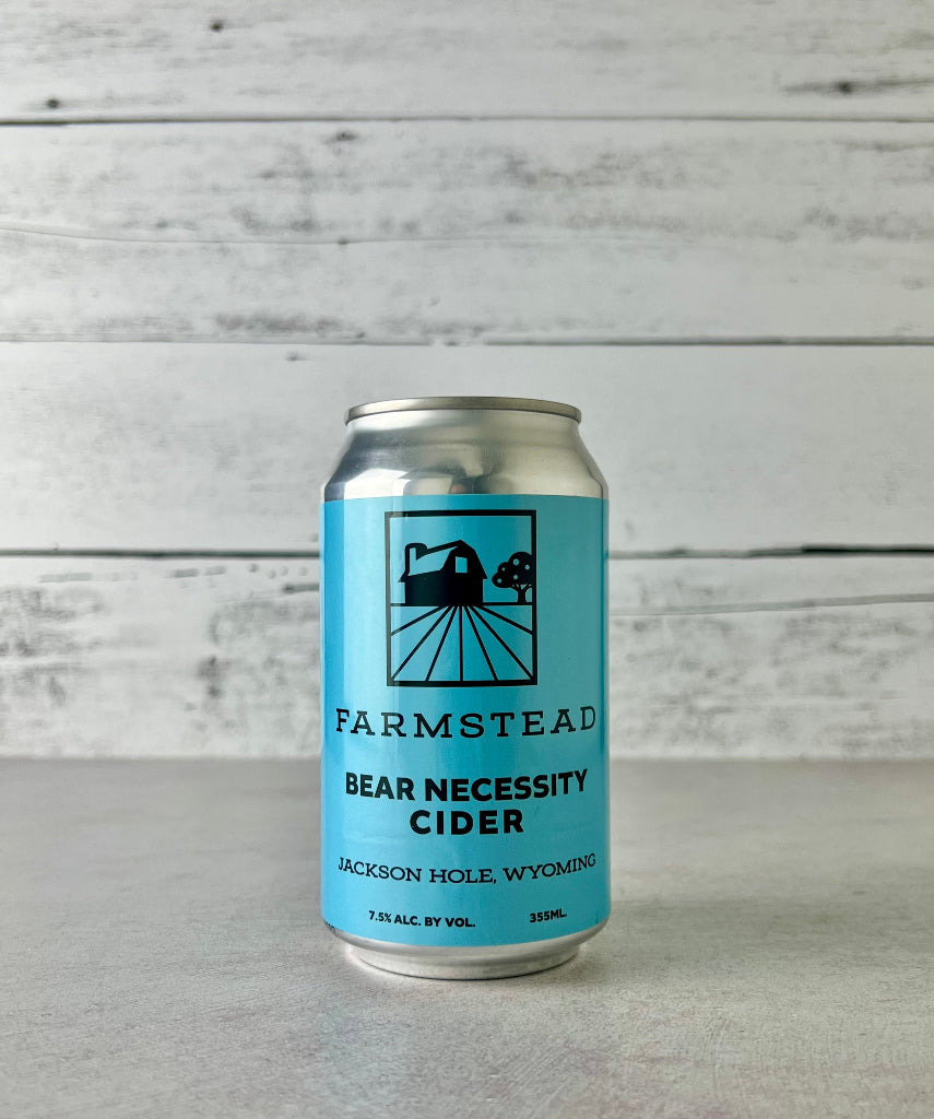 Can of Farmstead Bear Necessity Cider on a wooden background