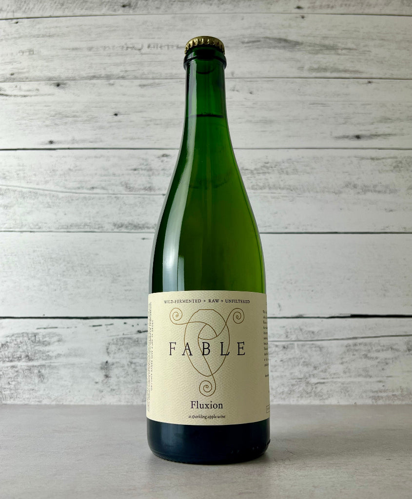 Photo of a 750 mL bottle of Fable Farm Fluxion - a sparkling apple wine - Wild Fermented - Raw - Unfiltered