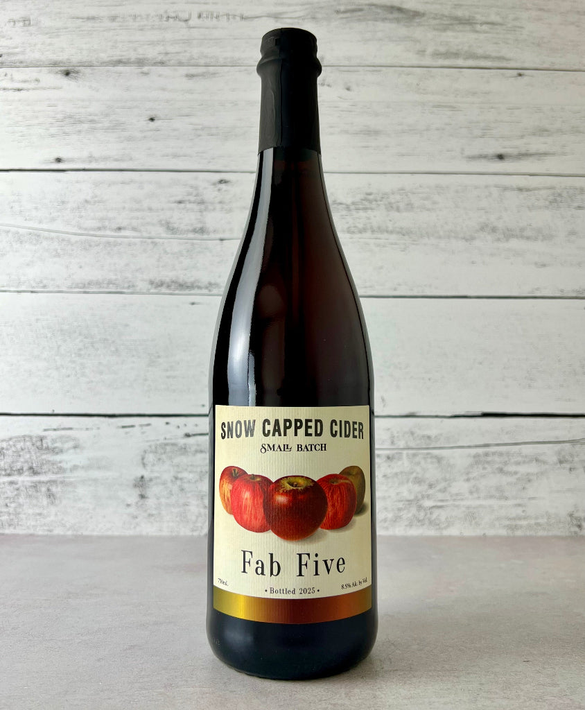 Photo of a 750 mL bottle of Snow Capped Cider Small Batch Fab Five cider