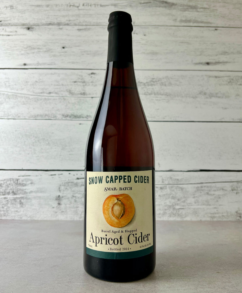 Photo of a 750 mL bottle of Snow Capped Cider Small Batch Apricot Cider Barrel Aged & Hopped