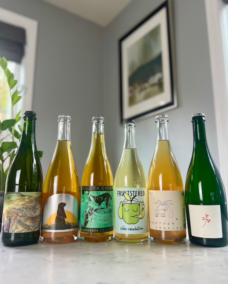 Six 750 mL bottles of natural ciders, including Botanist & Barrel, Art & Science, Barmann Cellars, Frukstereo, Brutes Cider