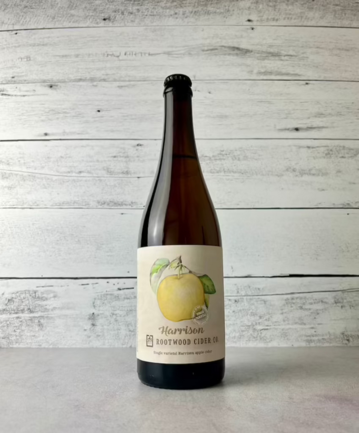 750 mL bottle of Rootwood Cider C. Harrison - Single varietal Harrison apple cider with artwork of a yellow Harrison apple