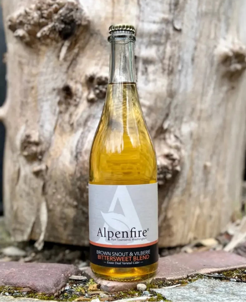 750 mL clear glass bottle of Alpenfire Brown Snout & Vilberie Bittersweet Cider Blend