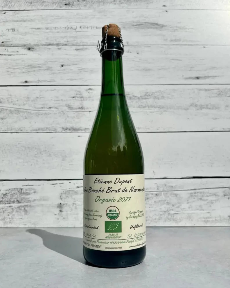 750 mL bottle of Etienne Dupont Cidre Bouché Brut de Normandy Organic cider 2021 with cork and cage top