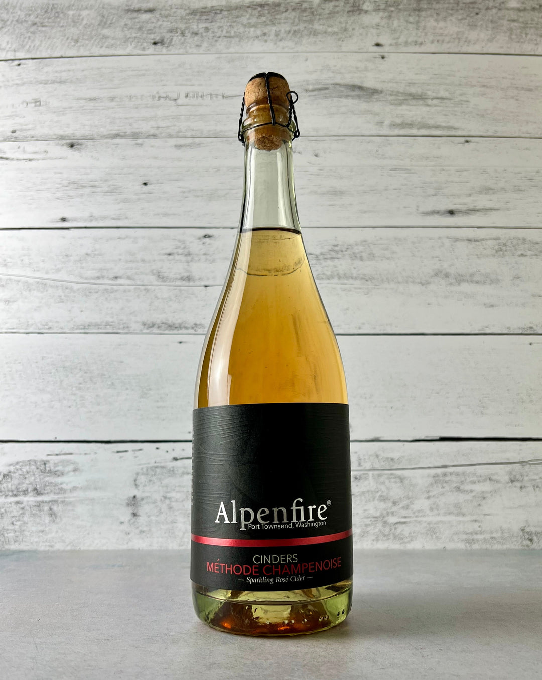 750 mL bottle of Alpenfire Cinders - Methode Champenoise - Sparkling Rosé Cider with cork and cage top